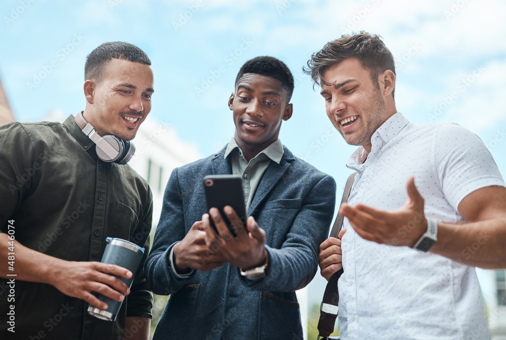 Making moves all over the city. Shot of a group of businesspeople using a smartphone together agains