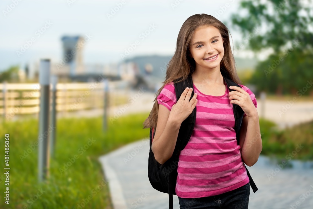 Young happy smart teenager schoolgirl pupil student wearing bag going back to school