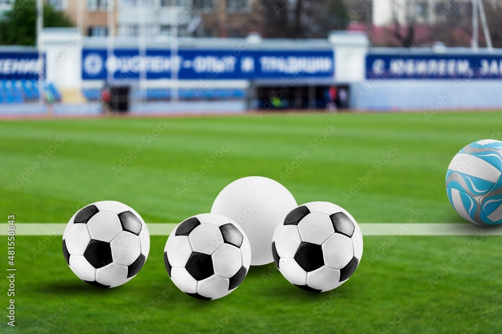 Official Champions match balls on the grass at the stadium