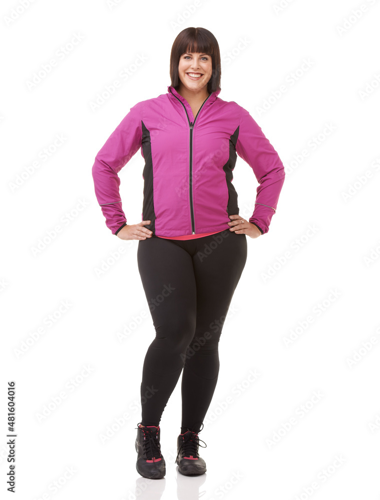 Shes all about getting fit. Full length shot of a plus size model in exercise clothes isolated on w