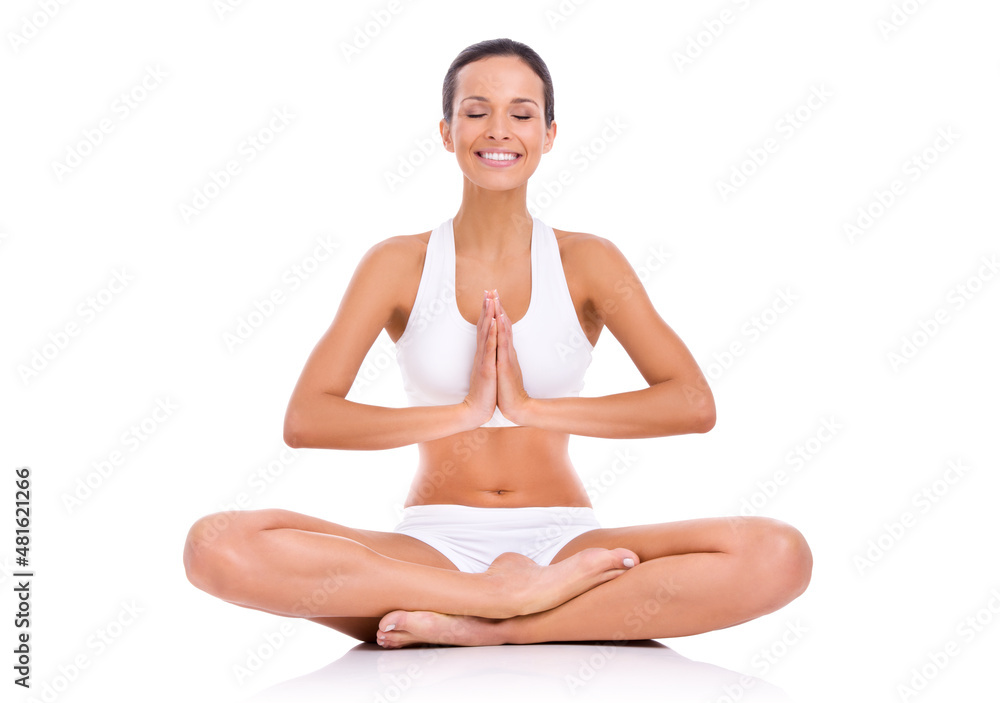 Mind and body health. Studio shot of a young woman in the lotus position isolated on white.