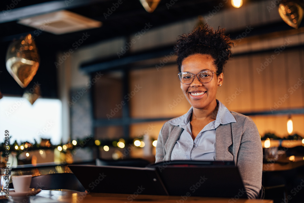 Portrait of smiling elegant woman, happy with her choice of food she ordered.