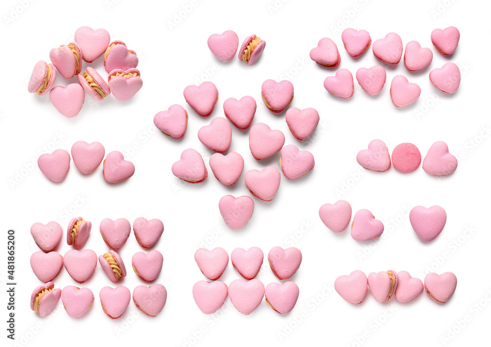 Tasty heart-shaped macaroons on white background, top view. Valentines Day celebration