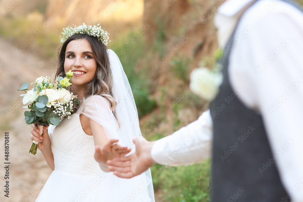 Happy wedding couple in countryside