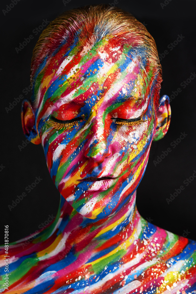 Beauty embraces every color. Studio shot of a young woman posing with brightly colored paint on her 