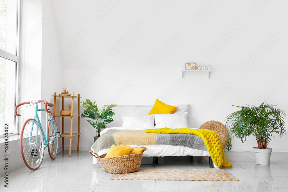 Interior of stylish bedroom with bicycle