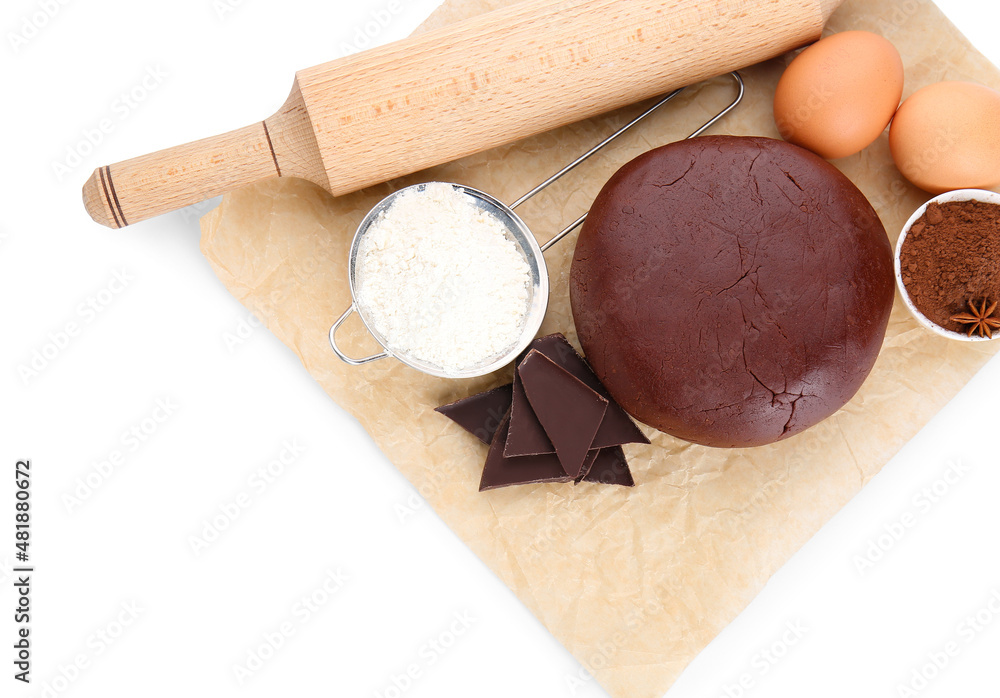 Ingredients for preparing tasty cookies and rolling pin on white background