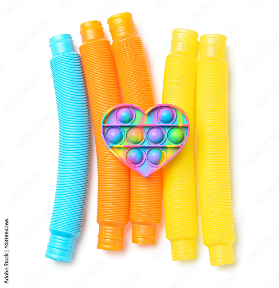 Colorful Pop Tubes and Pop it fidget toy on white background