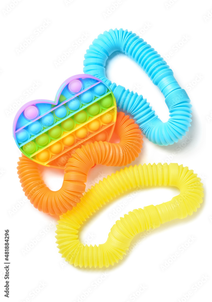 Colorful Pop Tubes and Pop it fidget toy on white background