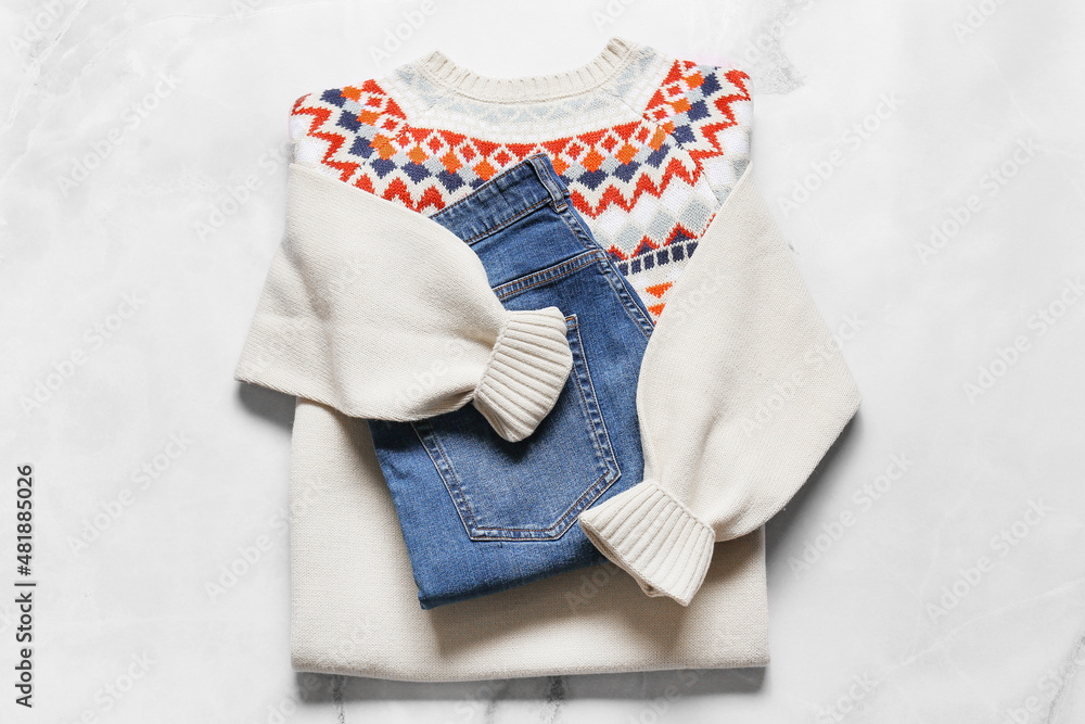 Male sweater and jeans on light background