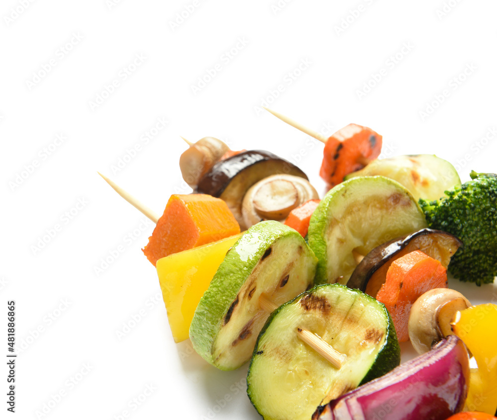 Skewers with vegetables on white background, closeup