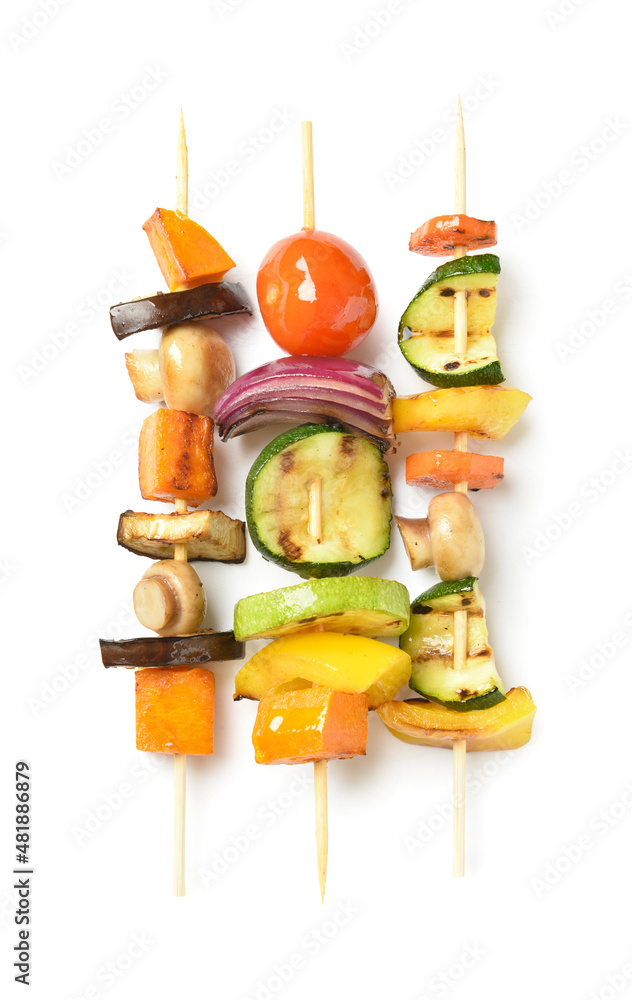 Skewers with vegetables on white background