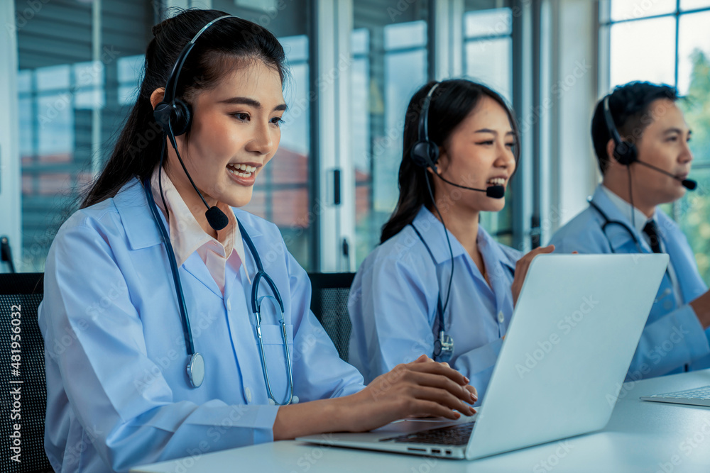 Doctor team wearing headset talking actively on video call in hospital clinic . Concept of telehealt