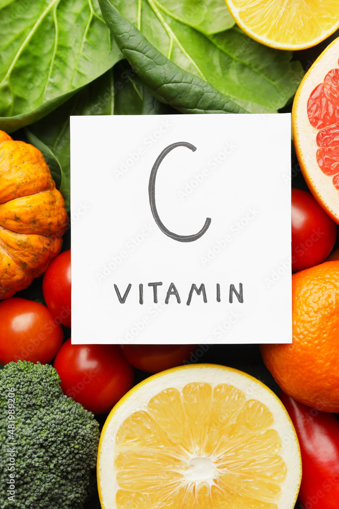 Text C VITAMIN and healthy products as background