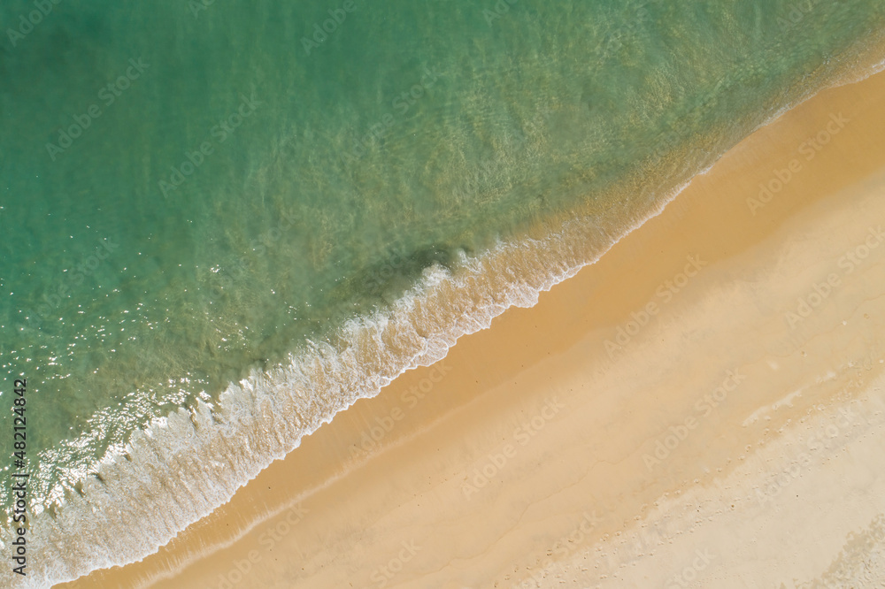 Aerial view sandy beach and waves Beautiful tropical sea in the morning summer season image by Aeria