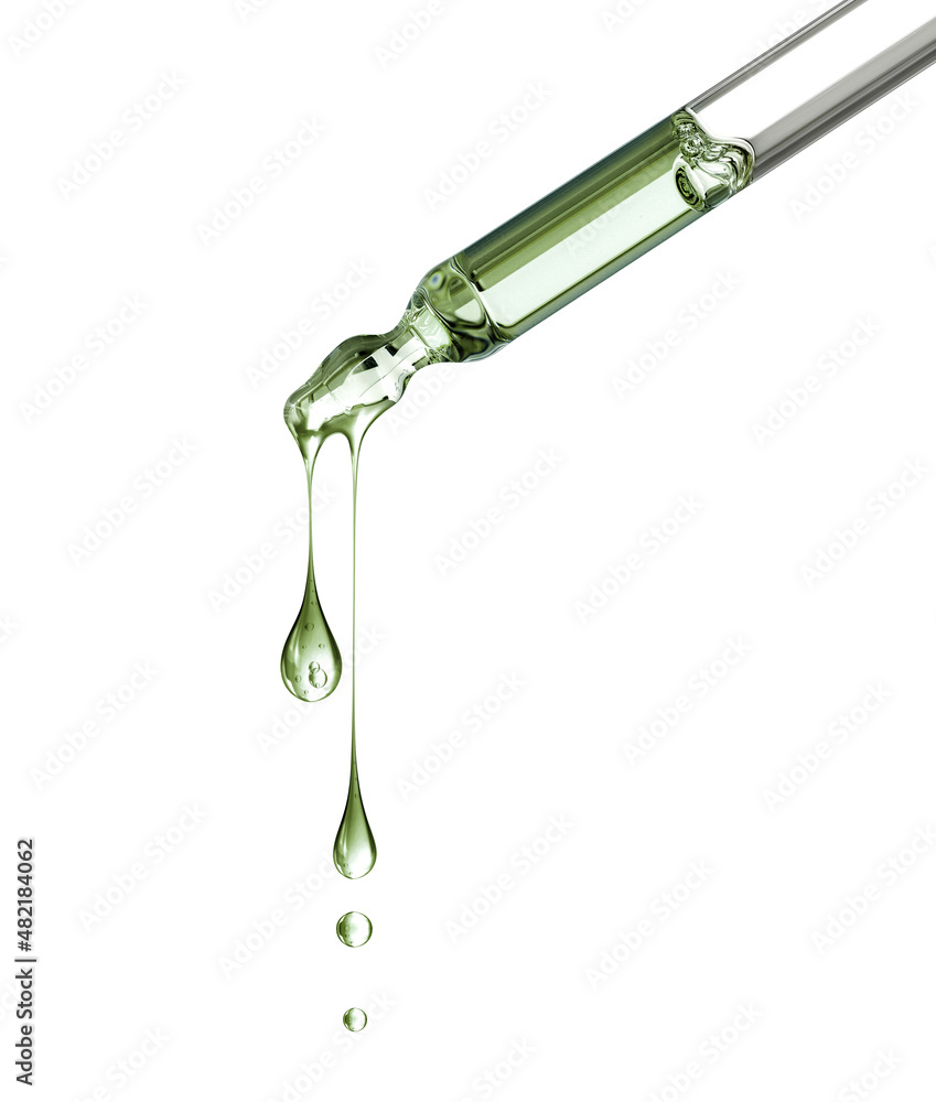 Two stretched oily drops falls from a pipette close-up isolated on a white background