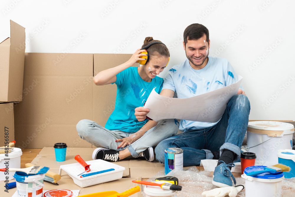 Happy boy and girl in protective headphones