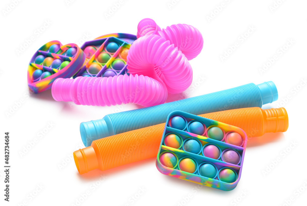 Colorful Pop Tubes and Pop it fidget toys on white background