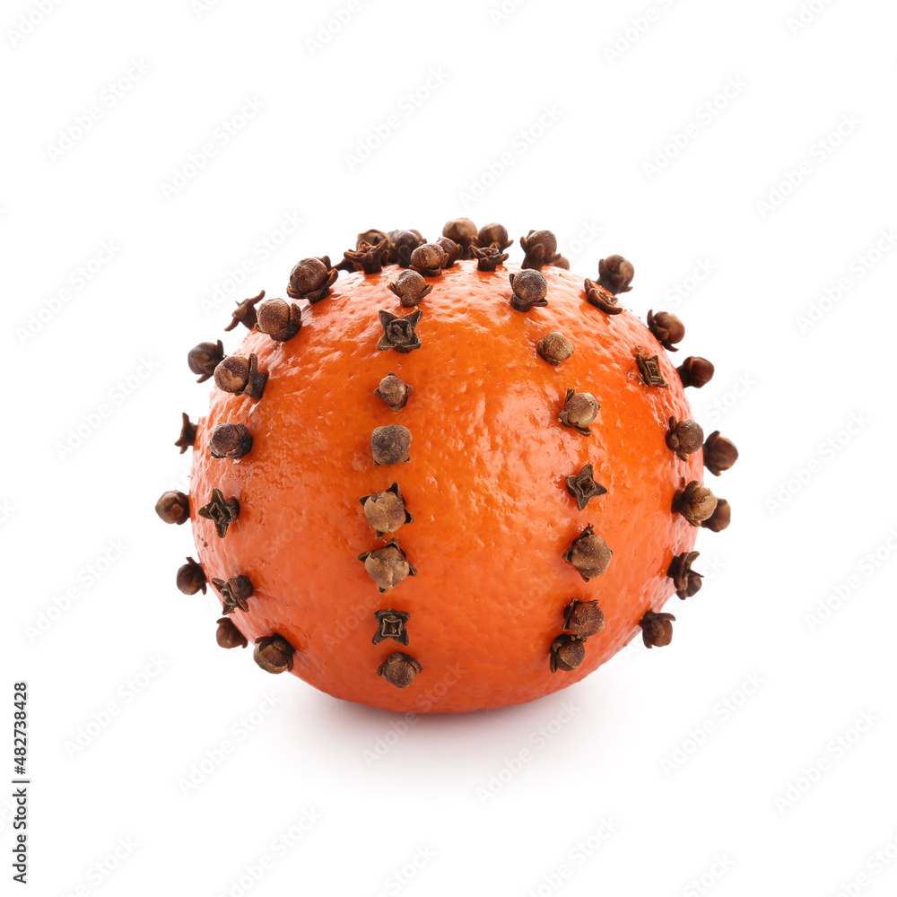 Handmade Christmas decoration made of tangerine with cloves on white background