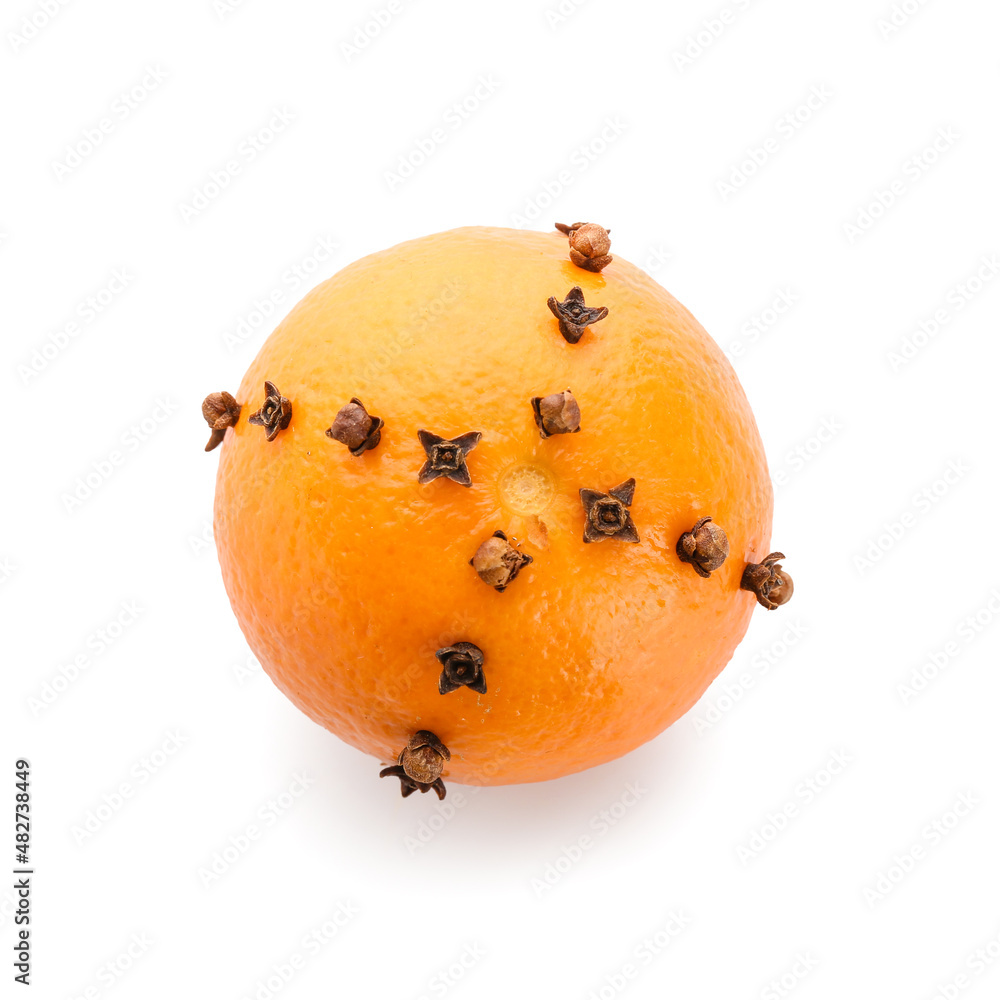 Handmade Christmas decoration made of tangerine with cloves on white background