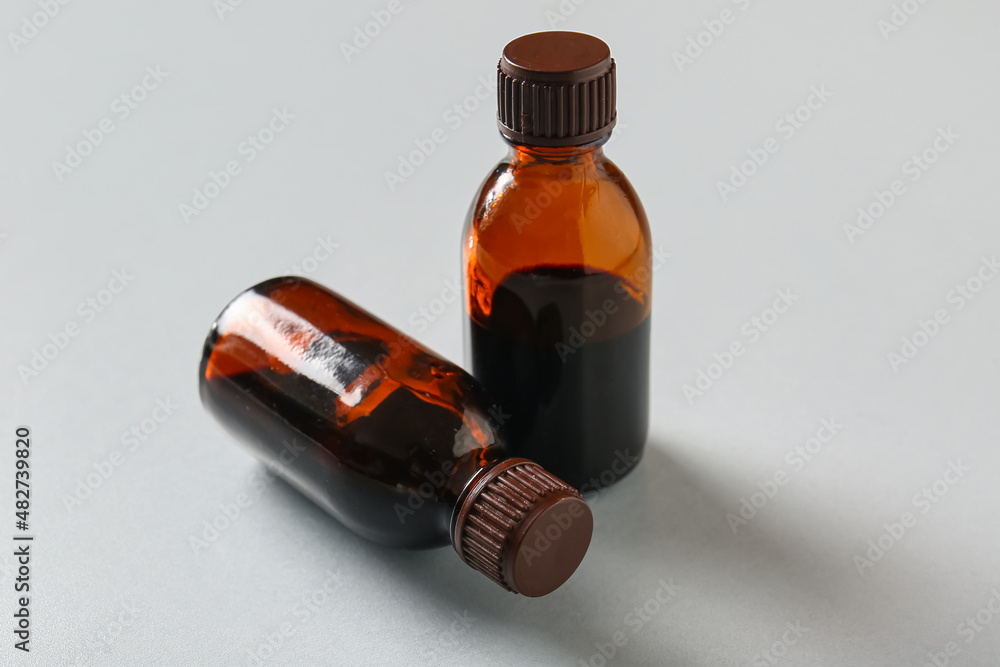 Bottles with iodine on grey background