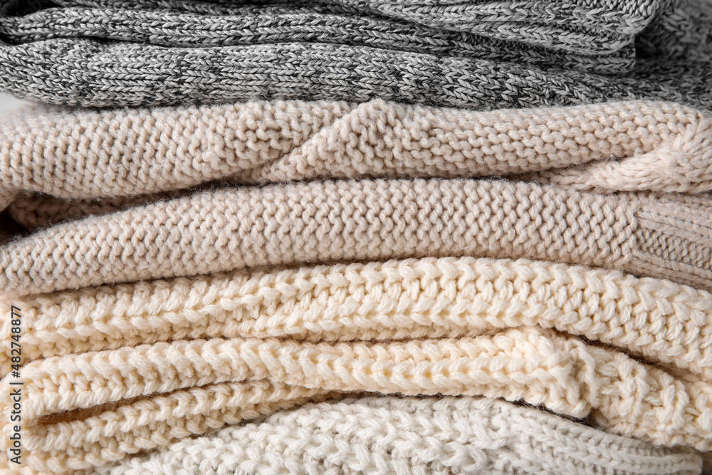 Texture of stylish baby sweaters, closeup