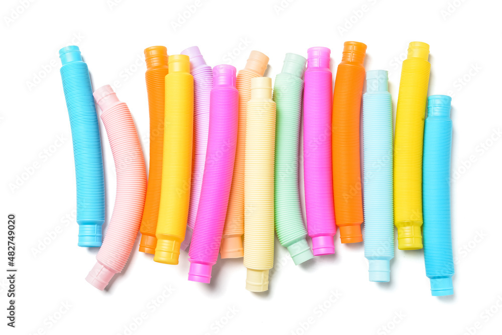 Different colorful Pop Tubes on white background