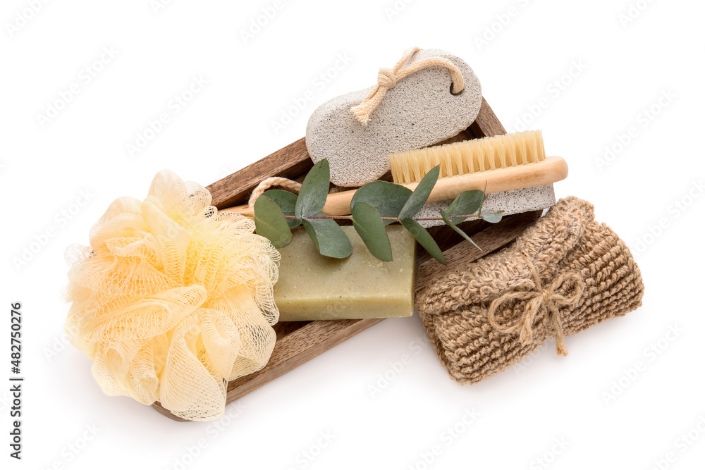 Wooden board with bath supplies isolated on white background