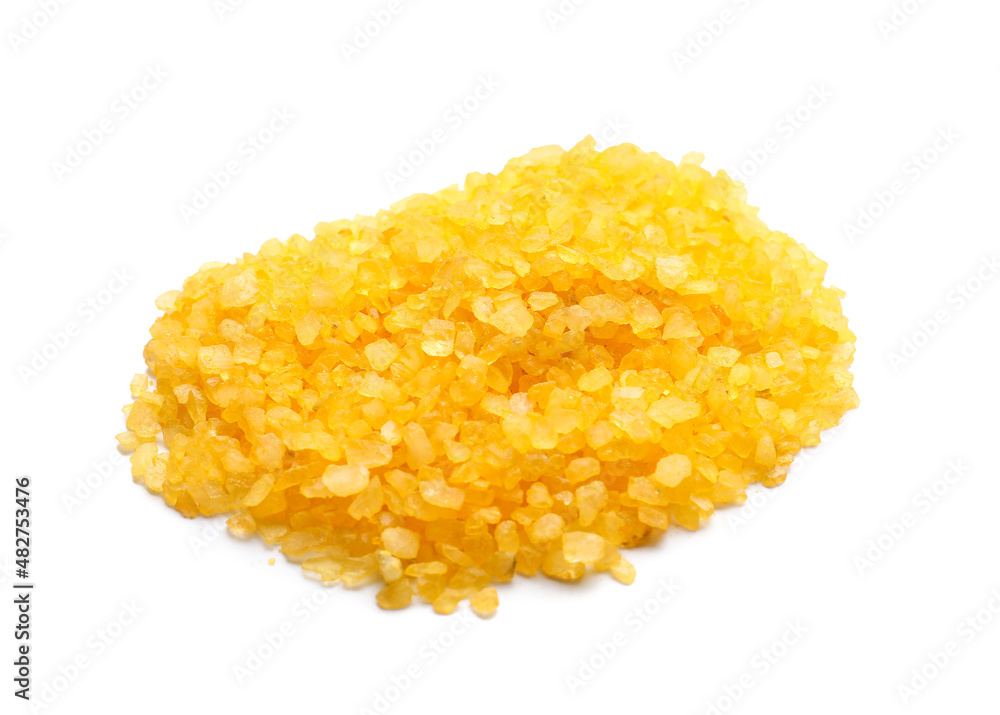 Heap of orange sea salt on white background