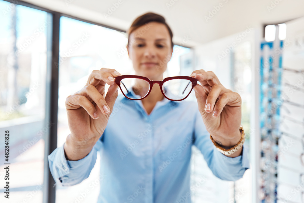 As glare free as it gets. Shot of a young woman buying a new pair of glasses at an optometrist store