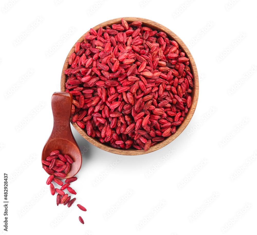 Bowl and spoon with dried barberries on white background