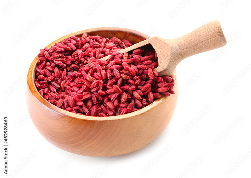 Bowl and scoop with dried barberries on white background