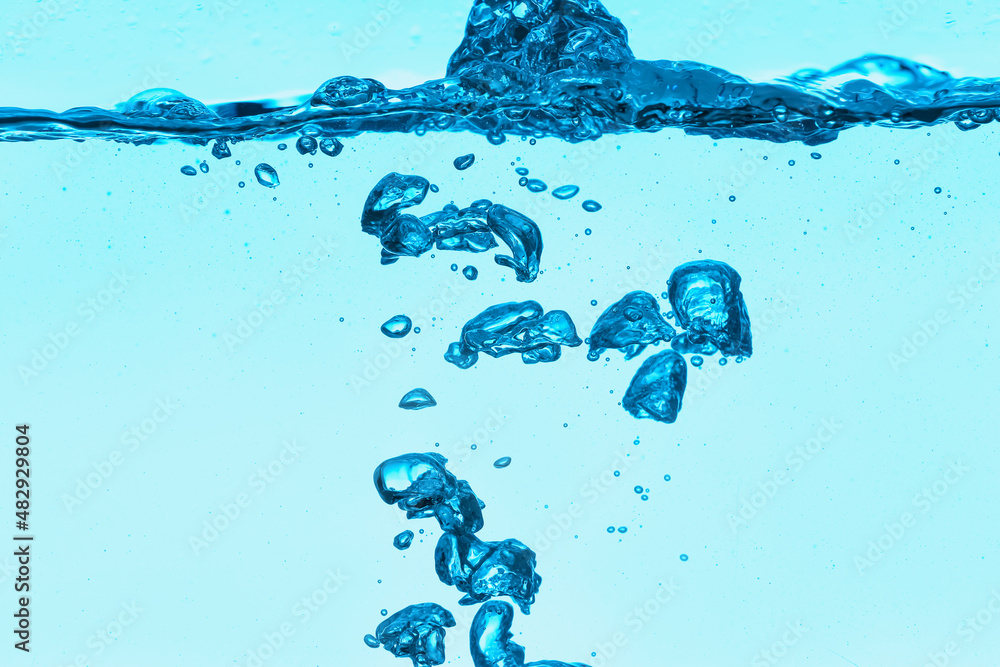 Clear water with air bubbles on blue background