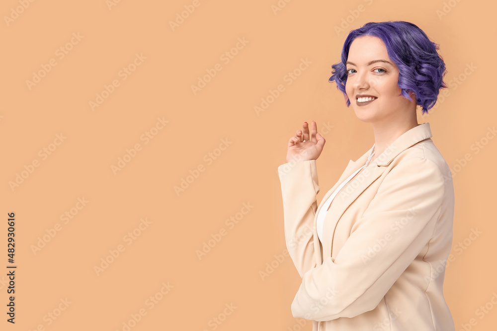 Beautiful young woman with violet hair on color background. Very Peri - color of year 2022