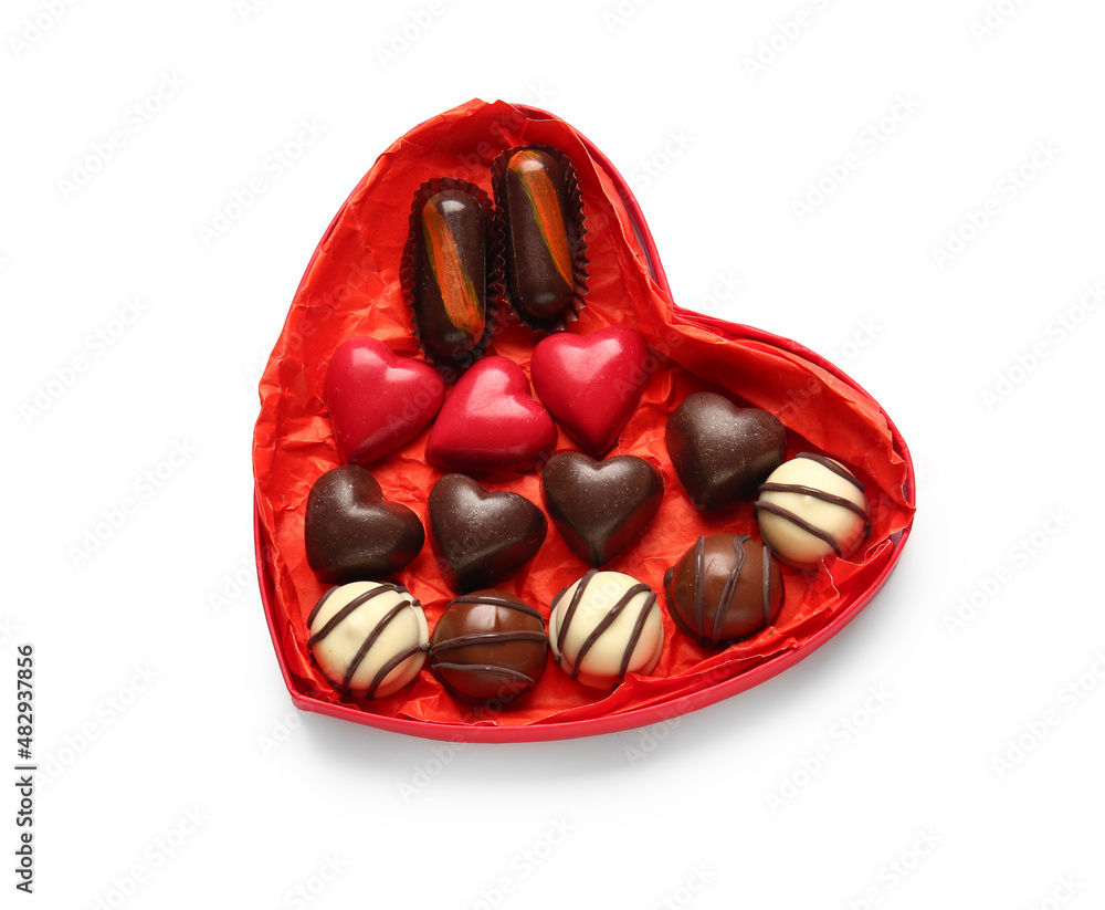 Heart shaped box with tasty chocolate candies isolated on white background