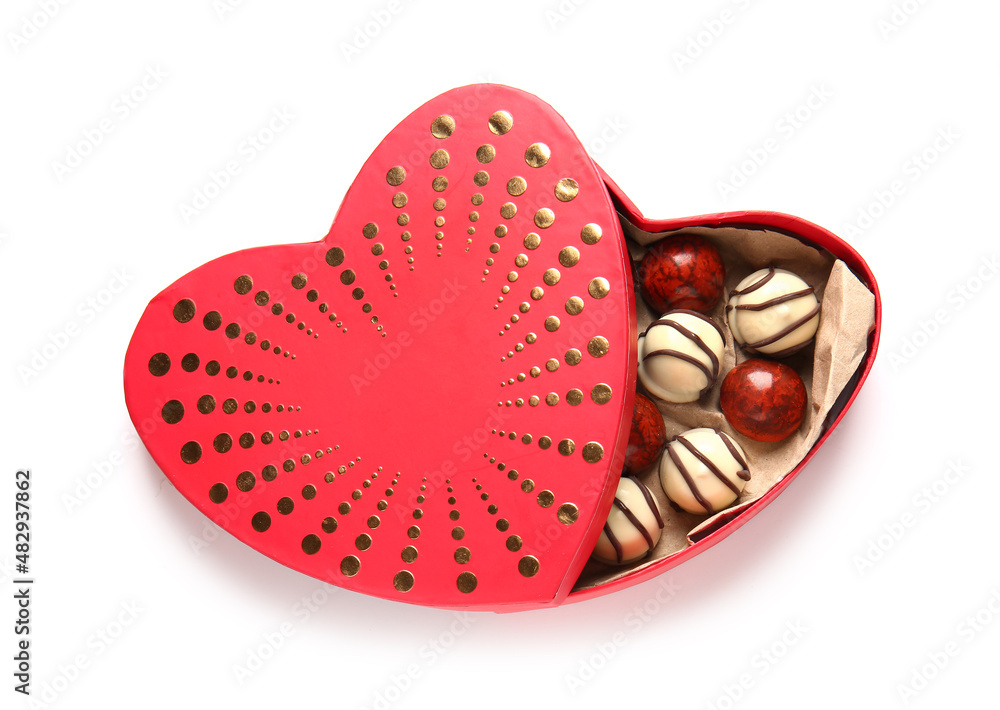 Heart shaped box with tasty chocolate candies isolated on white background