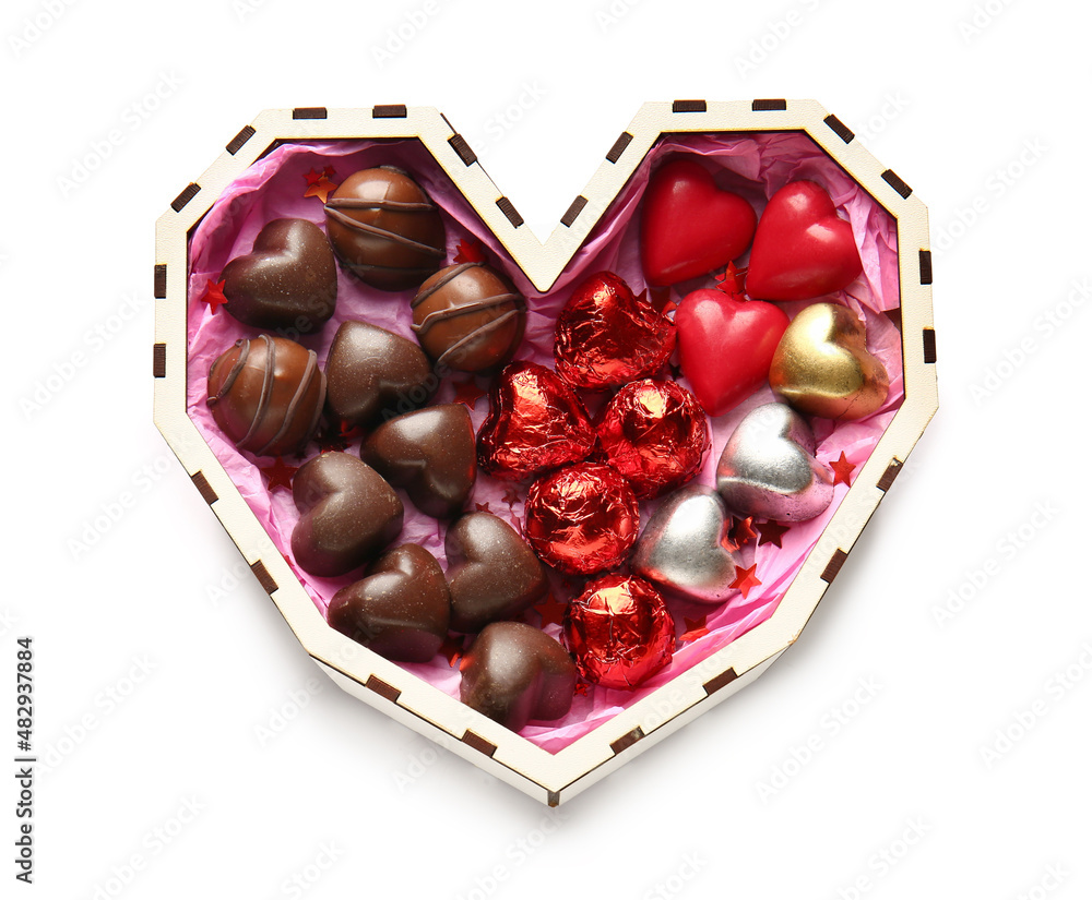 Heart shaped box with tasty chocolate candies isolated on white background