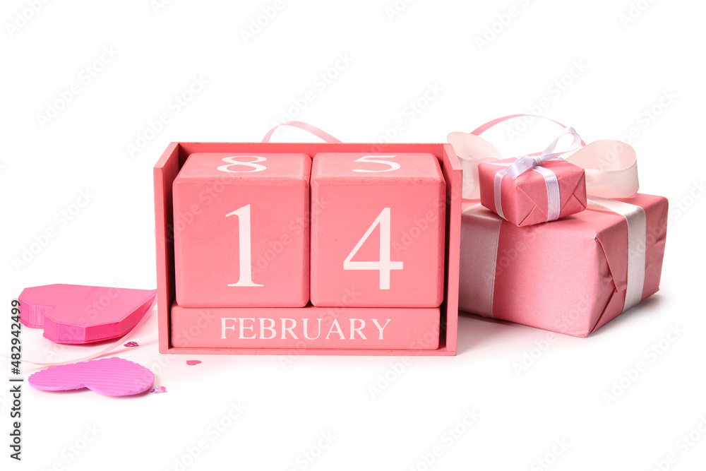 Calendar with date of Valentines Day and gift boxes on white background