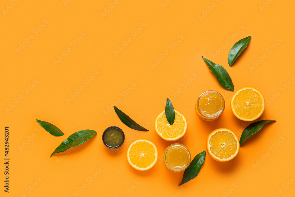 Composition with tasty orange jam on color background