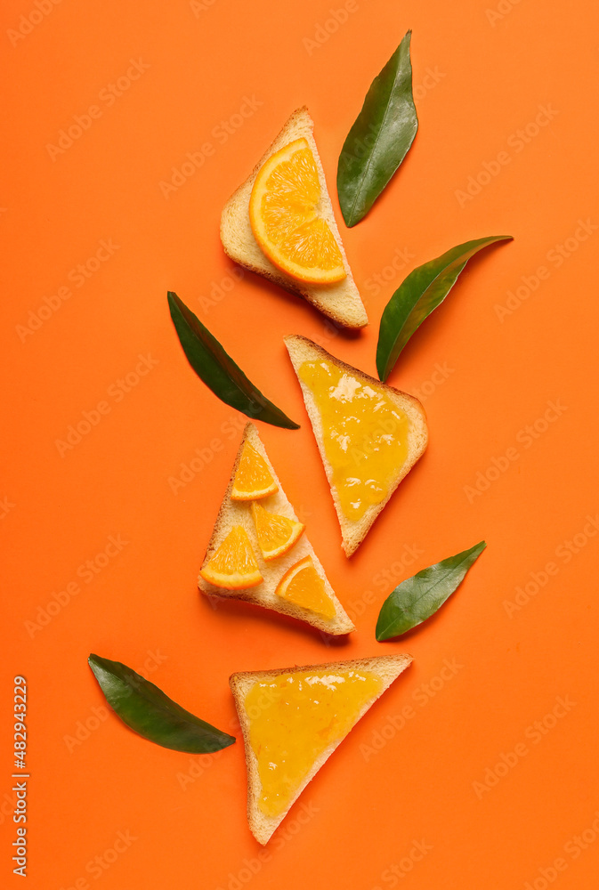 Composition with tasty orange jam and toasts on color background