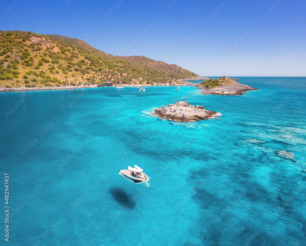 Aerial view of beautiful yacht on the sea at sunny day in summer. Akvaryum koyu in Turkey. Top view 