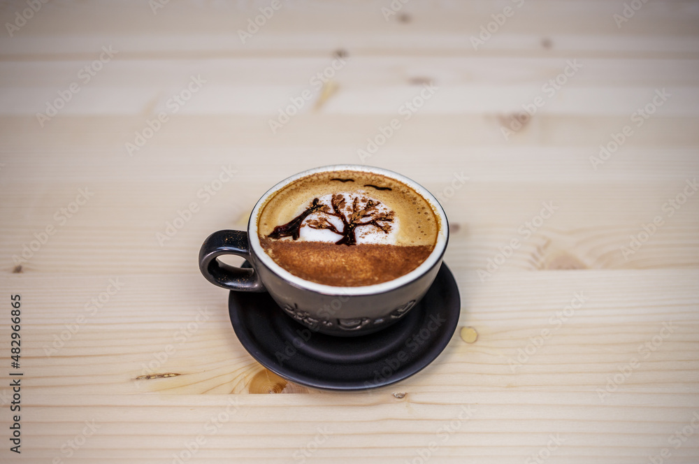 Artist draw coffee on table with wood background and coffee beans