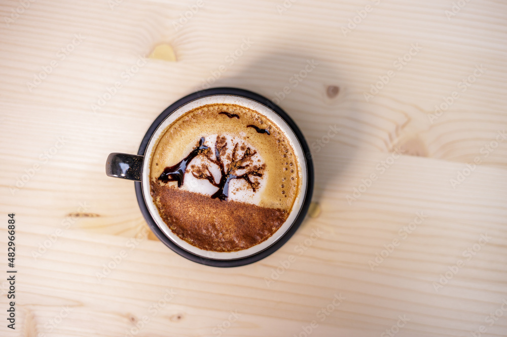 Artist draw coffee on table with wood background and coffee beans