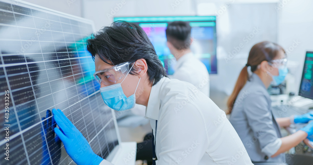 asian engineer with solar panel