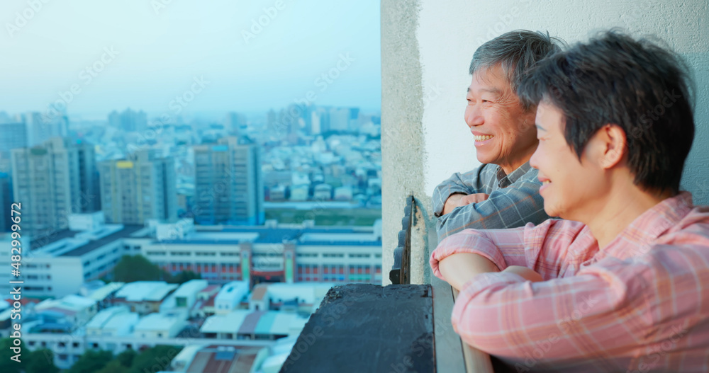 senior couple looking outside