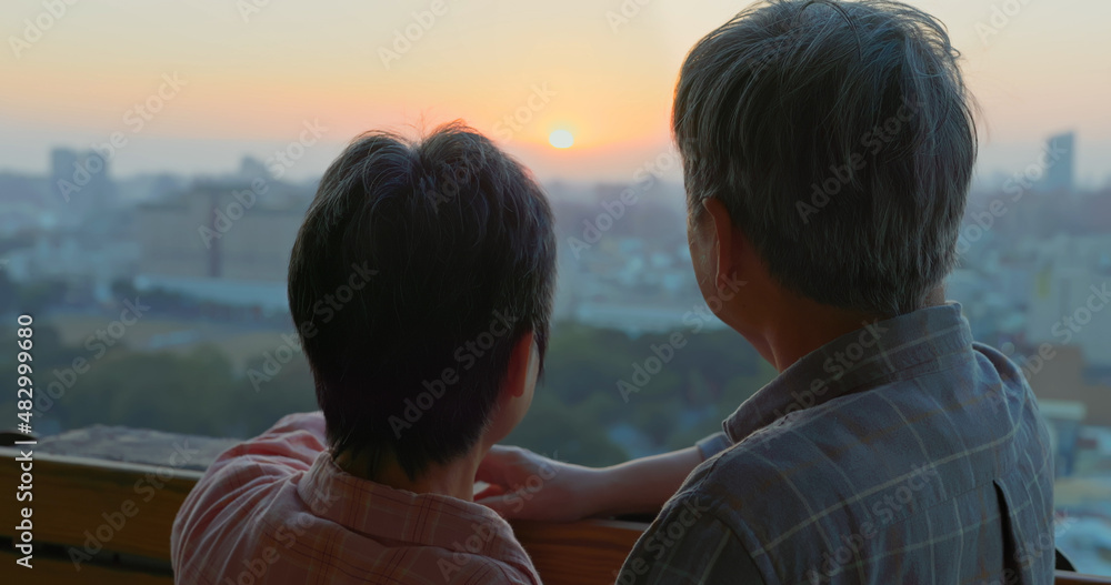 senior couple looking outside