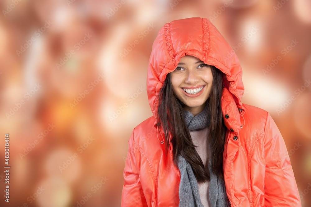 Happy playful young woman smiles posing on background