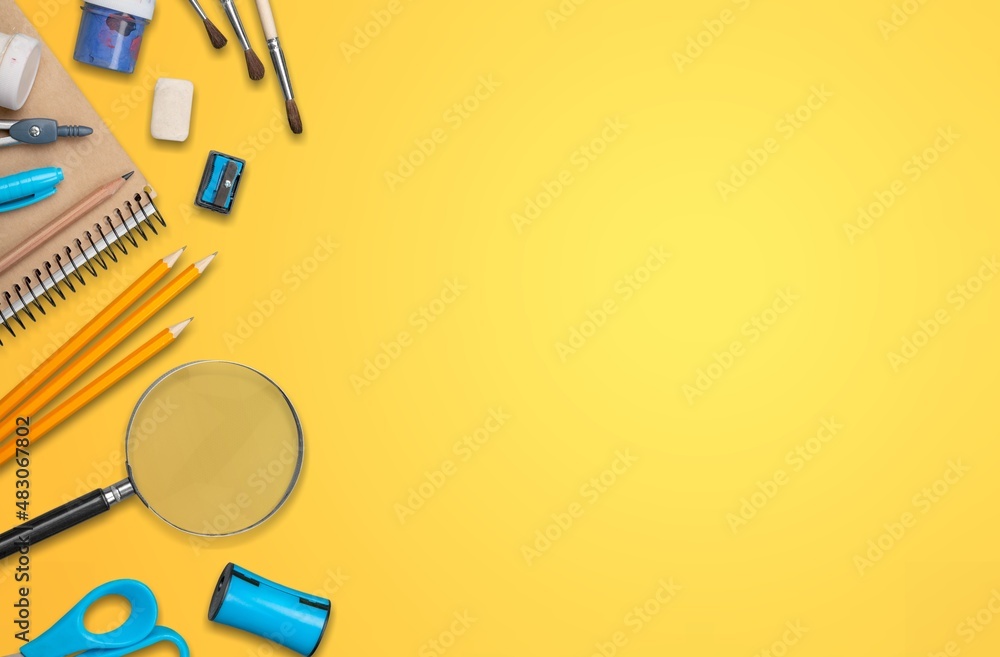 Back to school concept. Colorful stationary school supplies on the desk