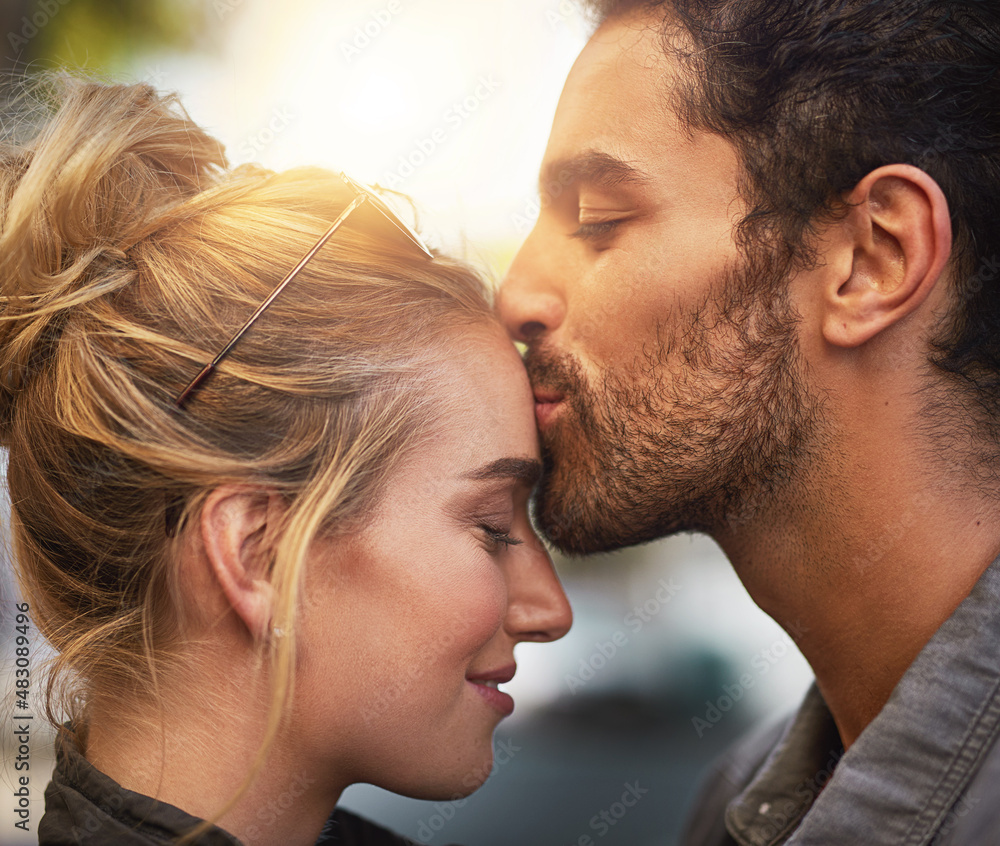 Shes so special to me. Cropped shot of a young man kissing his girlfriends forehead.