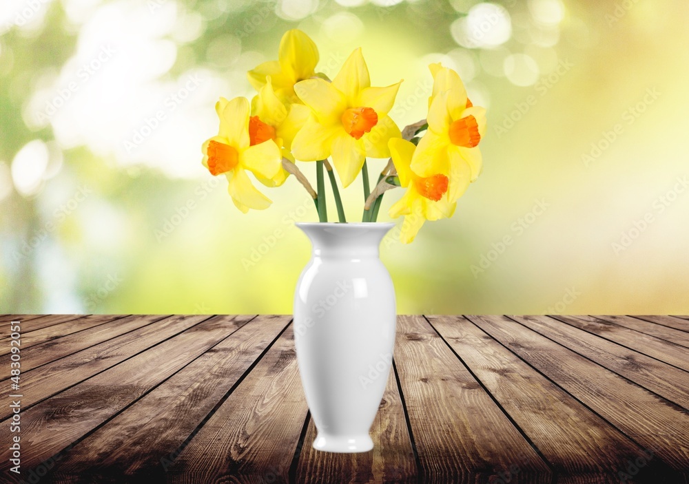 Autumn still life with garden flowers. Beautiful bouquet in a vase on wooden table.